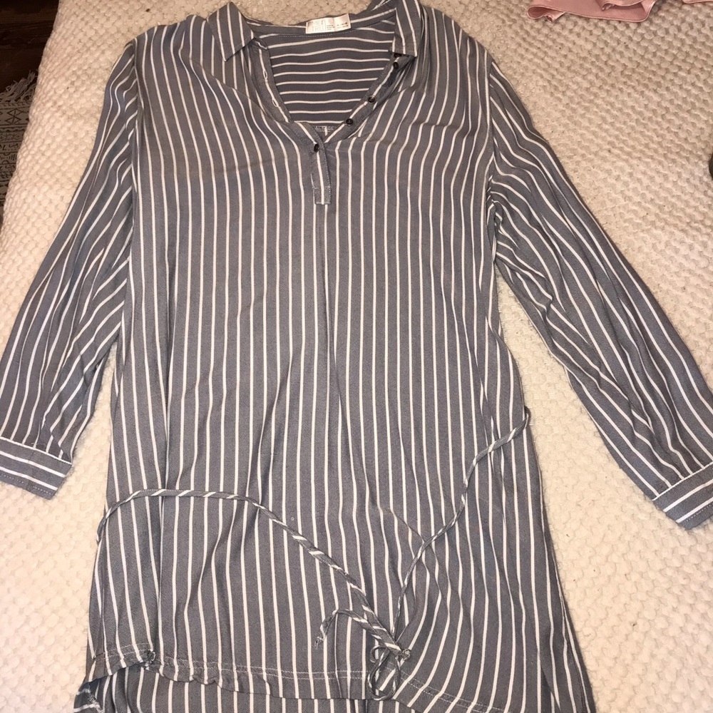 A light blue and white vertical-striped dress